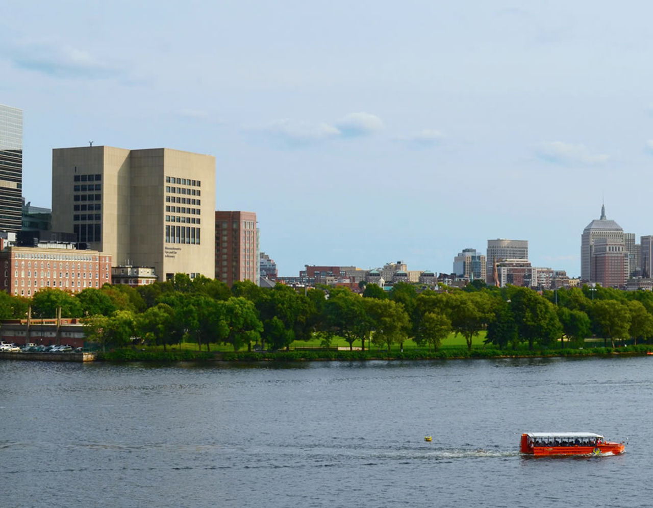 Mass Eye and Ear building with boat in Charles River