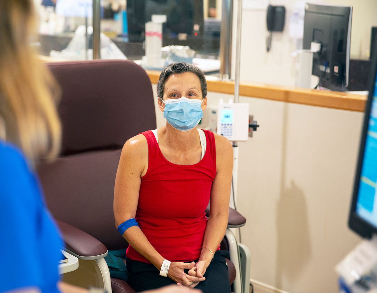 Female patient with provider in exam room 