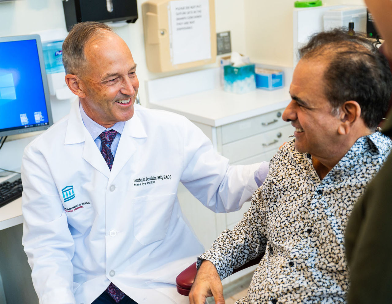 Dr. Daniel Deschler meets with patient