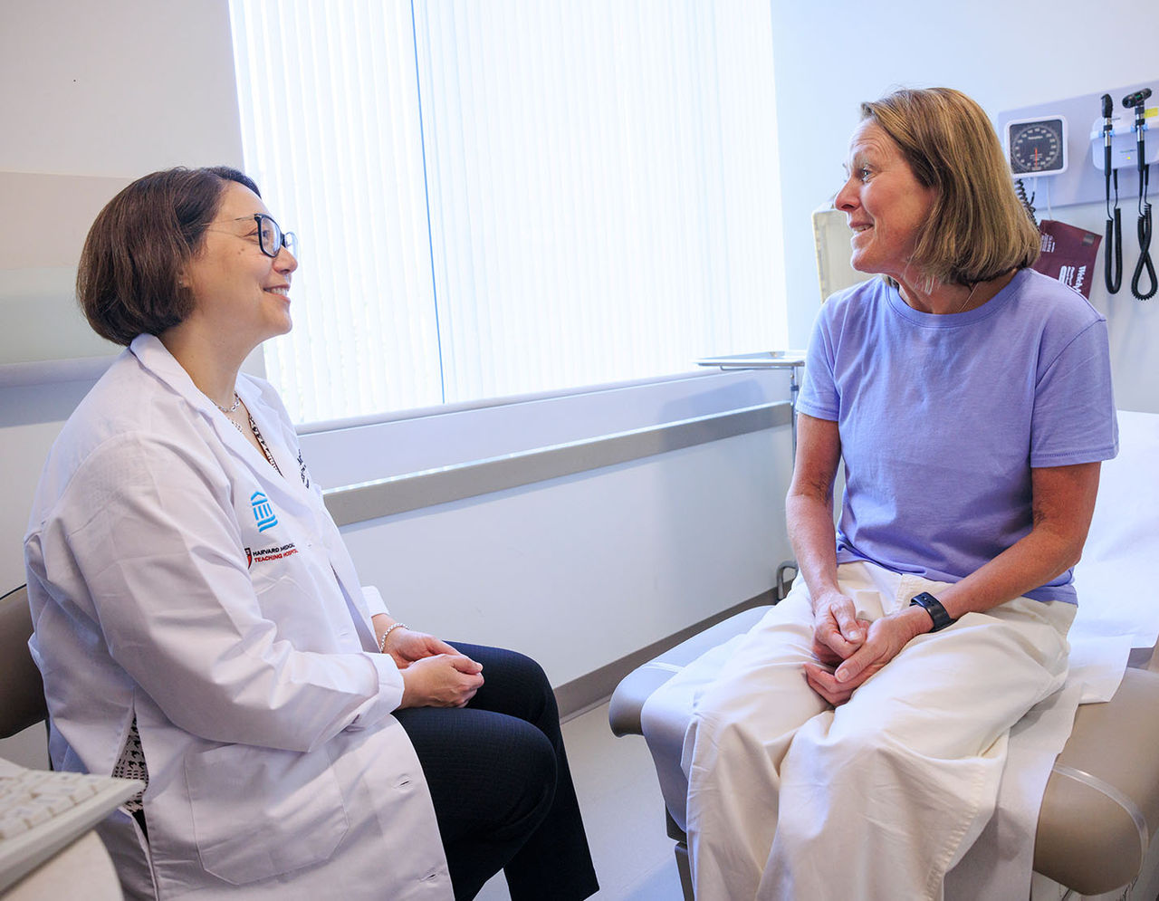 Dr. Lecia Sequist with female patient in exam room
