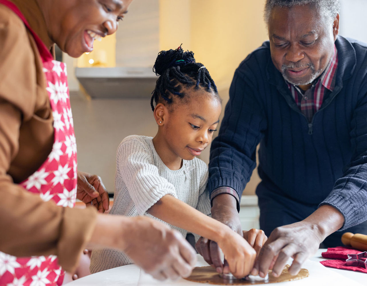 family making cookies in kitchen