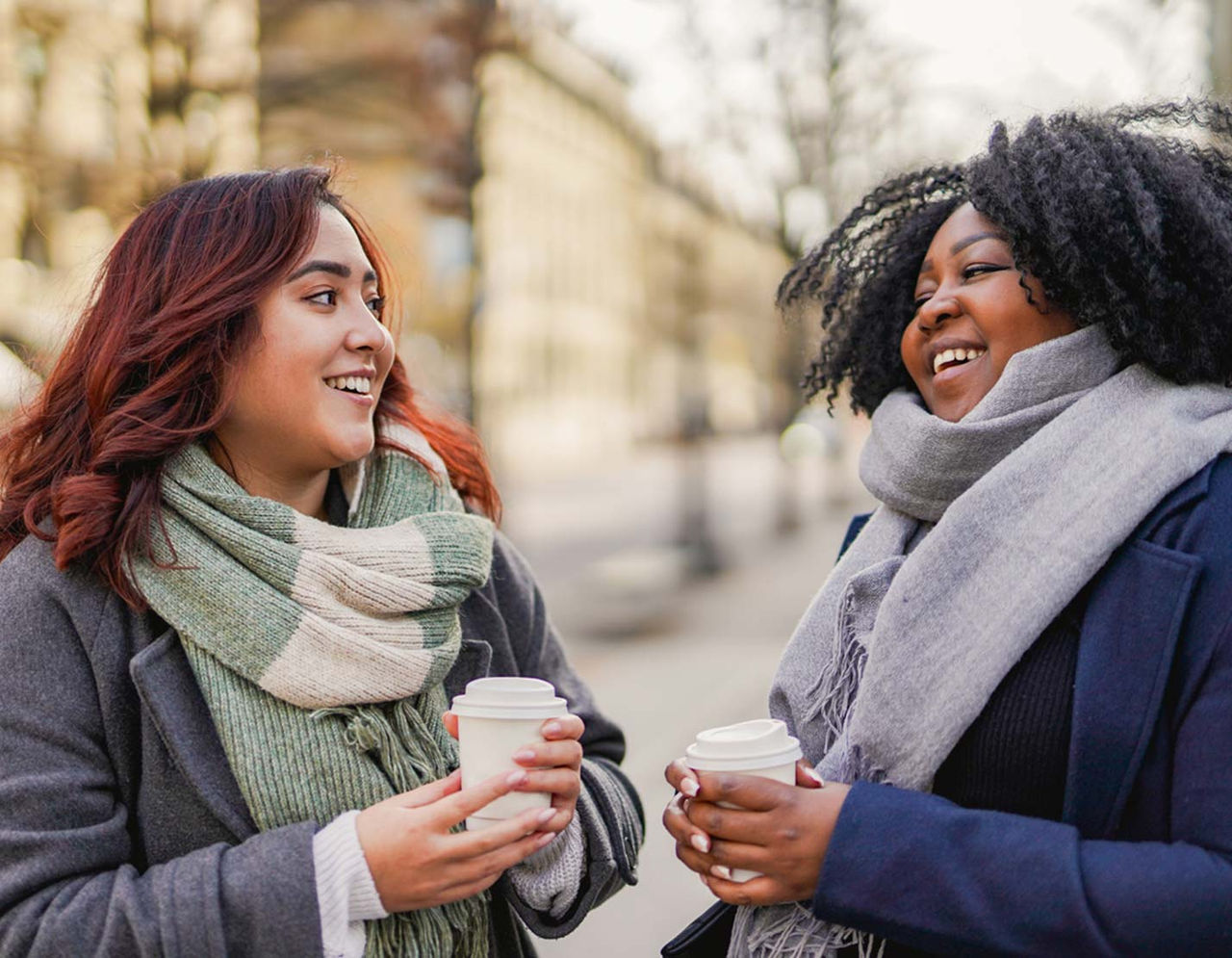 Two women enjoying coffee outdoors