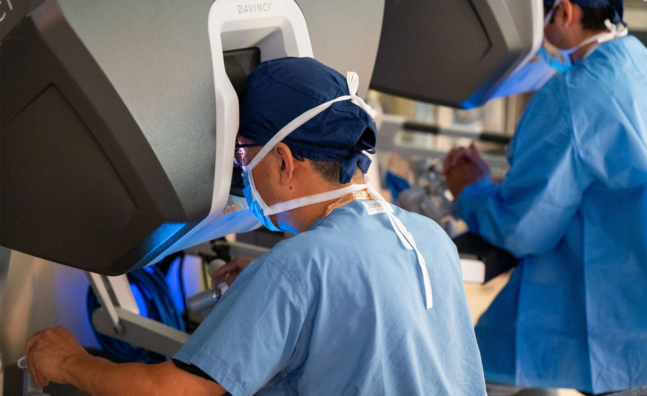 Surgeon performing robotic surgery at Mass General Brigham.