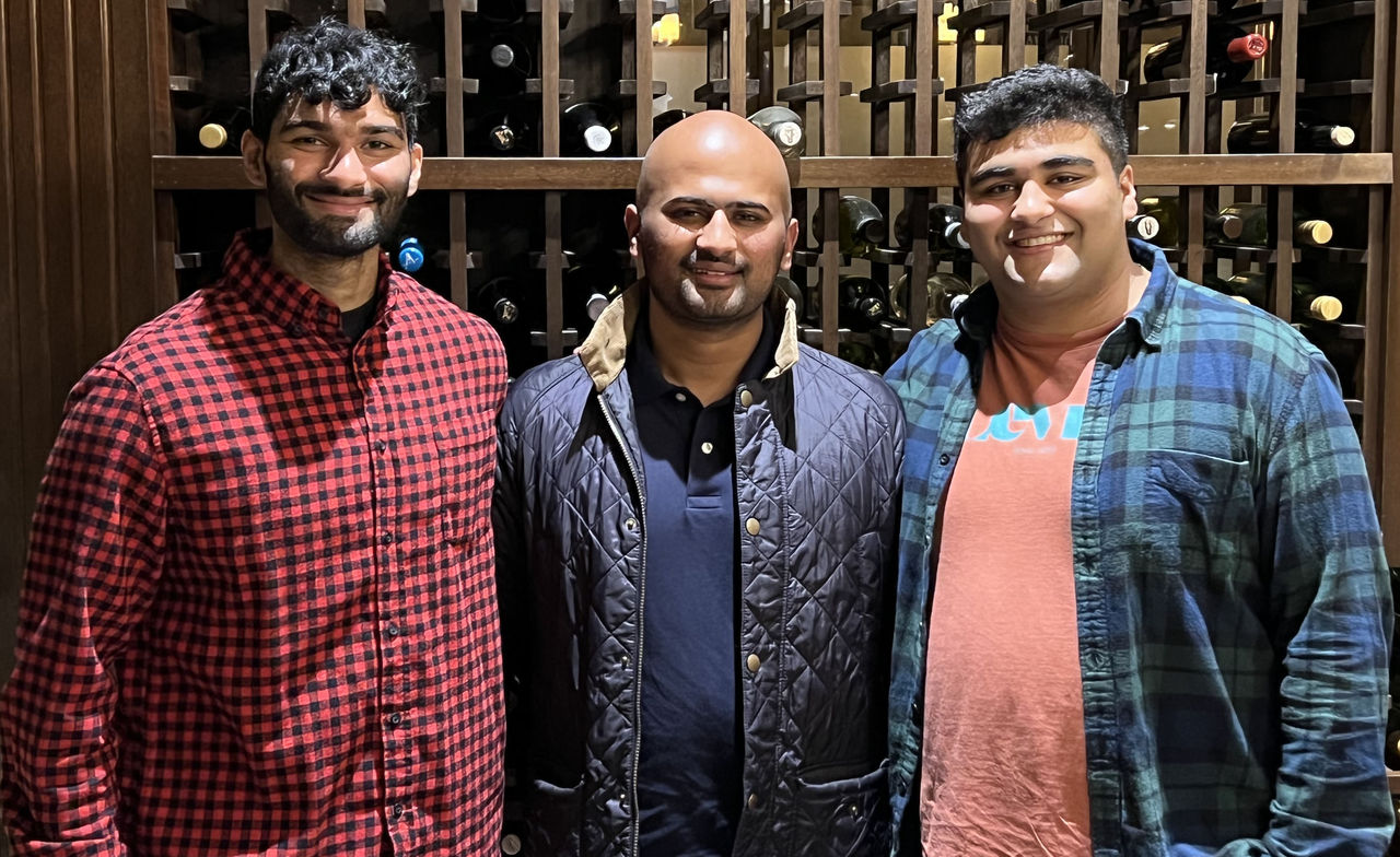 Rohan Venkatesh (center) with his two brothers at his birthday party in 2022.