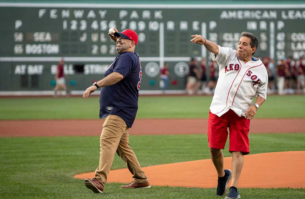 Chuck Samiotes and his cardiac surgeon, Dr. Eriberto Michel, throwing out the ceremonial first pitch at a Boston Red Sox game.