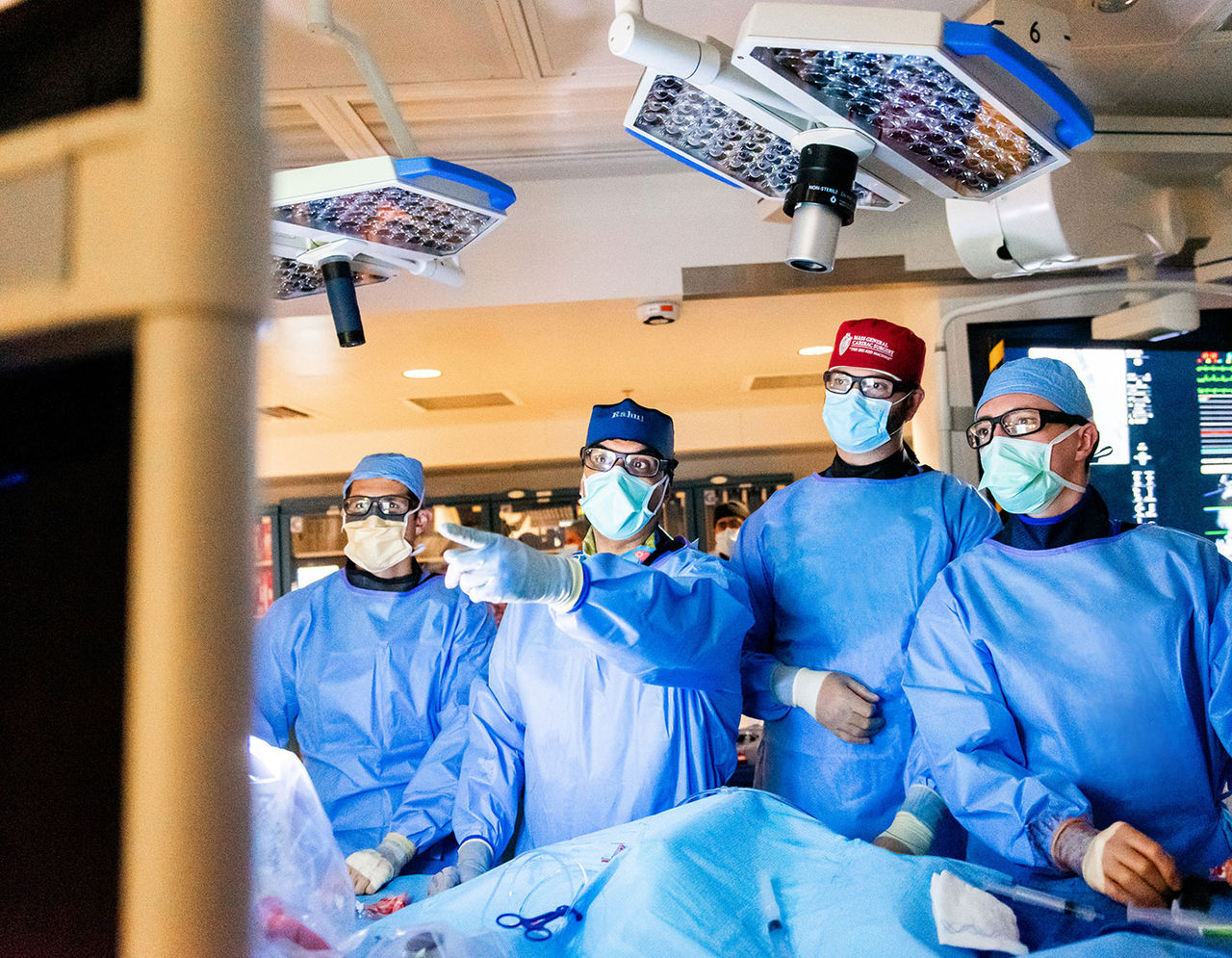 heart providers performing surgery on patient in operating room