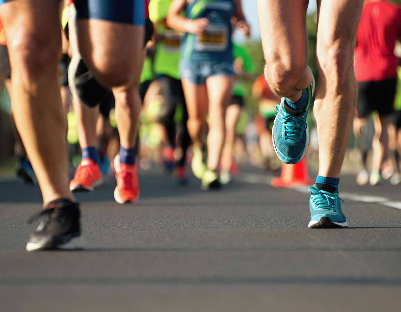 close up of legs running a race