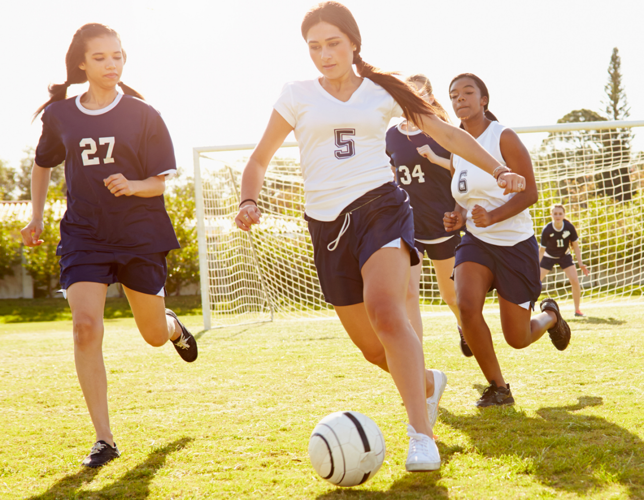 female soccer players on field