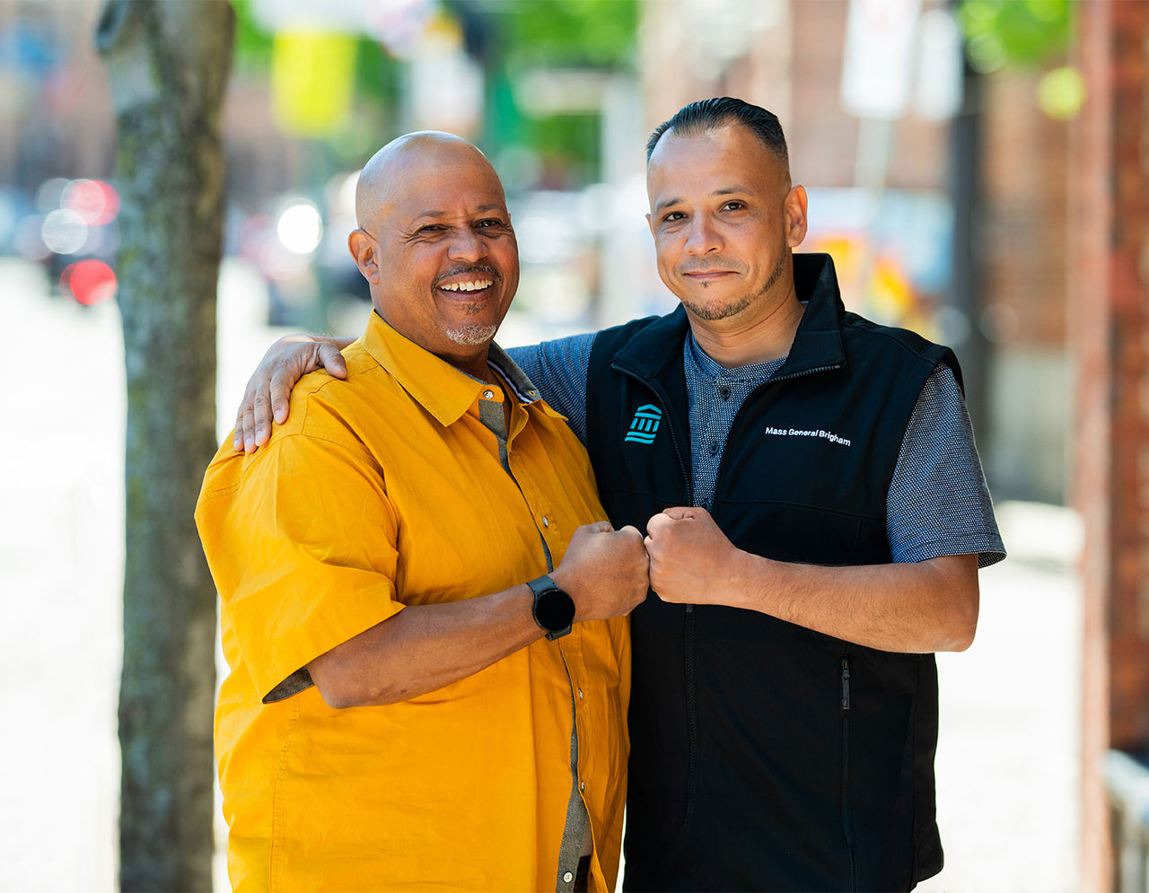 Two men fist bump