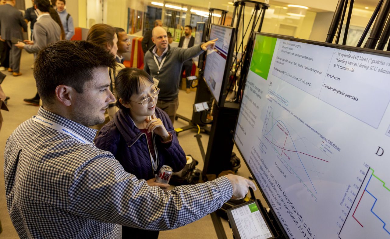 Attendees at the 2024 GCTI symposium poster session