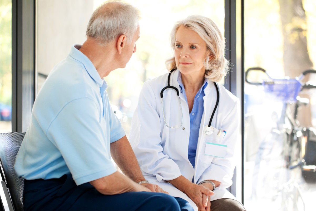 doctor and patient talking while sitting