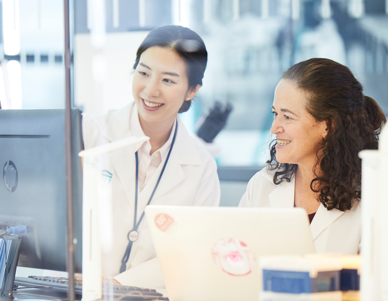 two female researchers at computer in lab setting