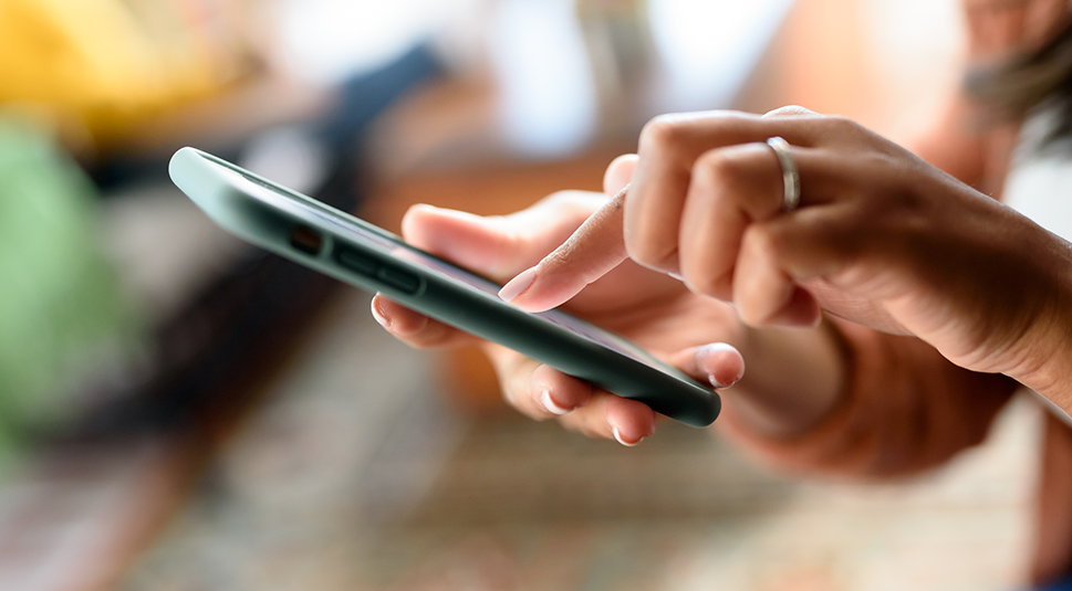 person holding cell phone in hand