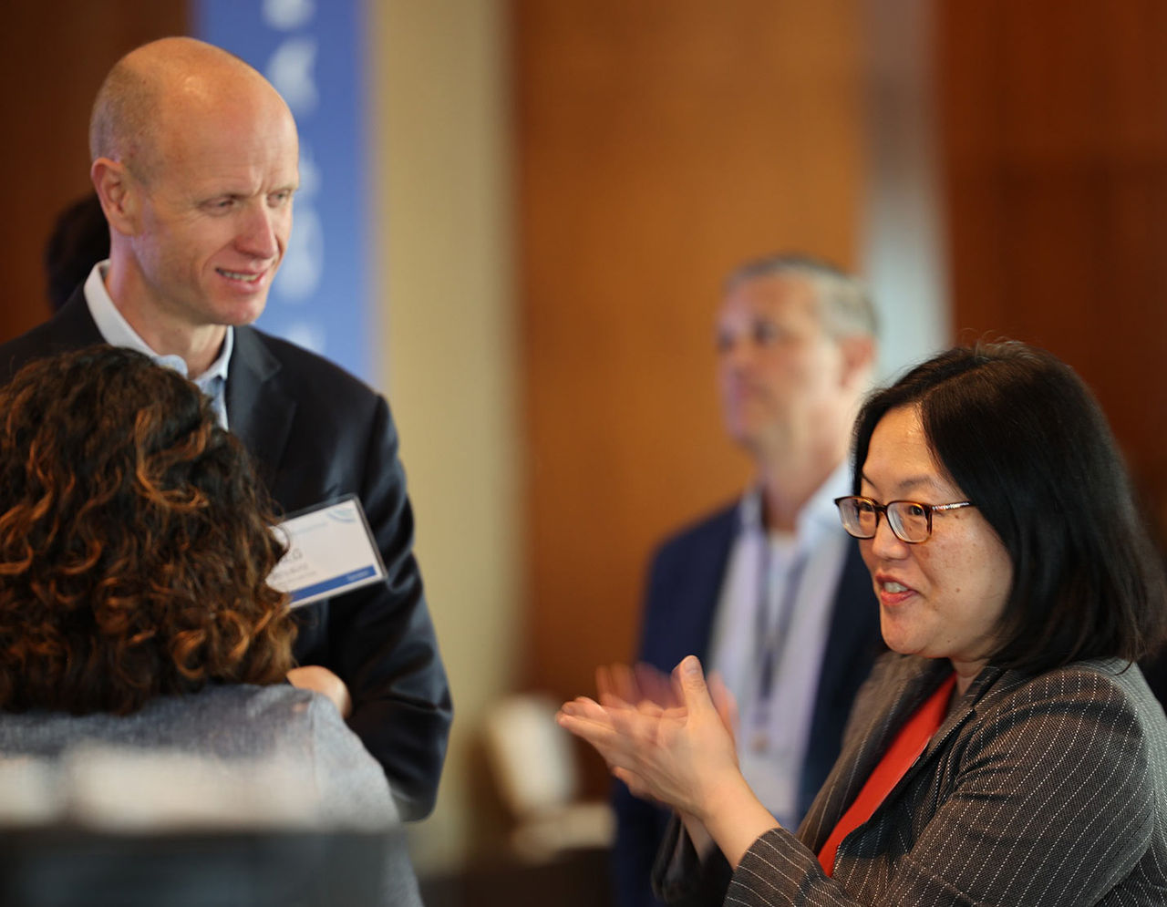 Three colleagues having a conversation