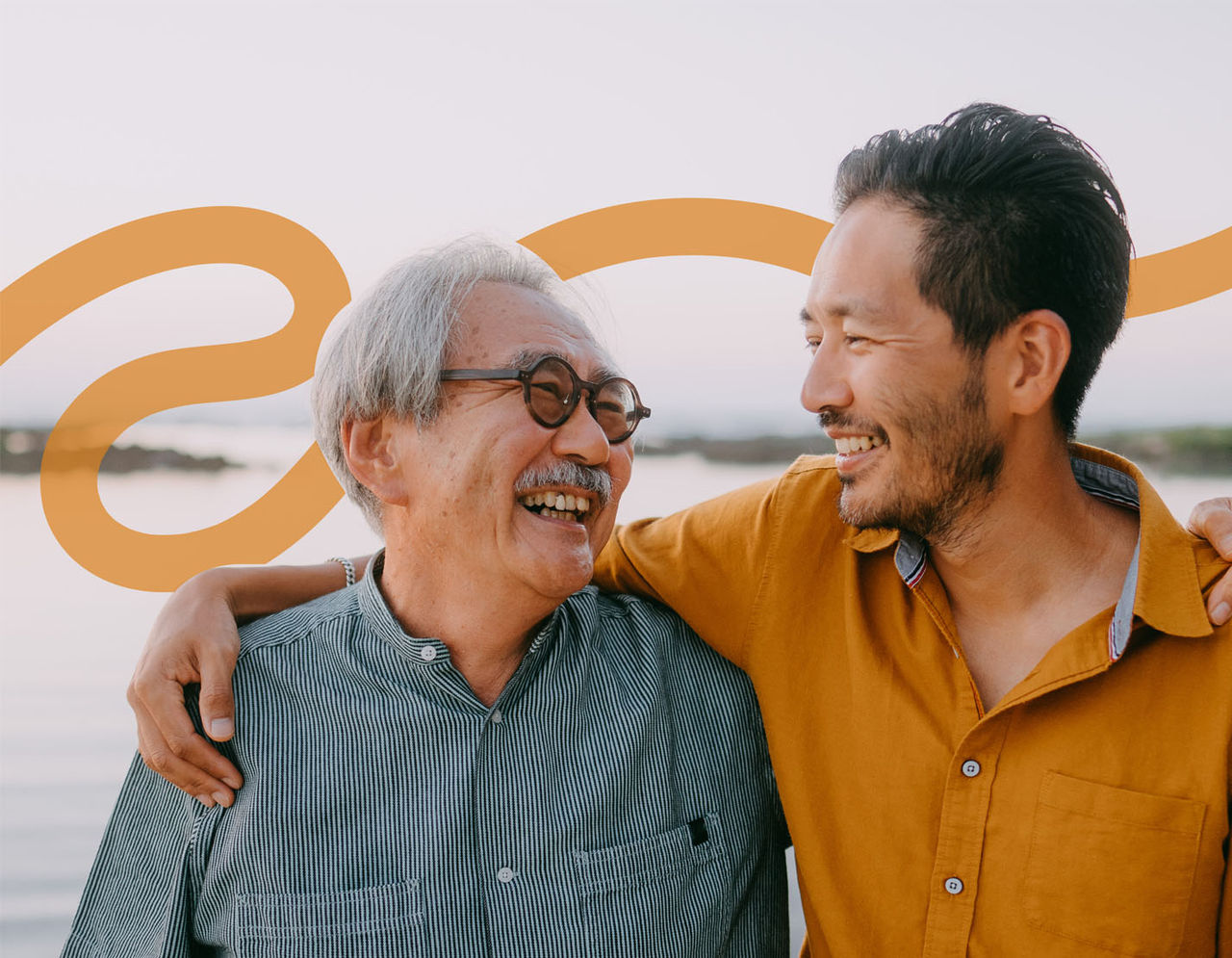 Two men smiling at each other