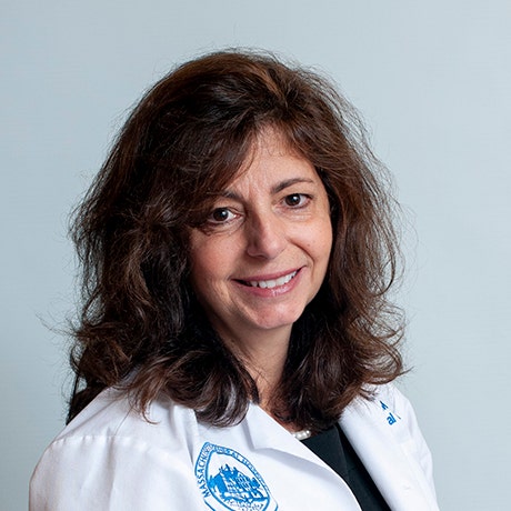Lela Caros, MD