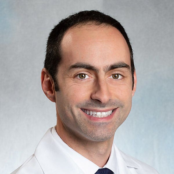 Daniel A Wollin, MD